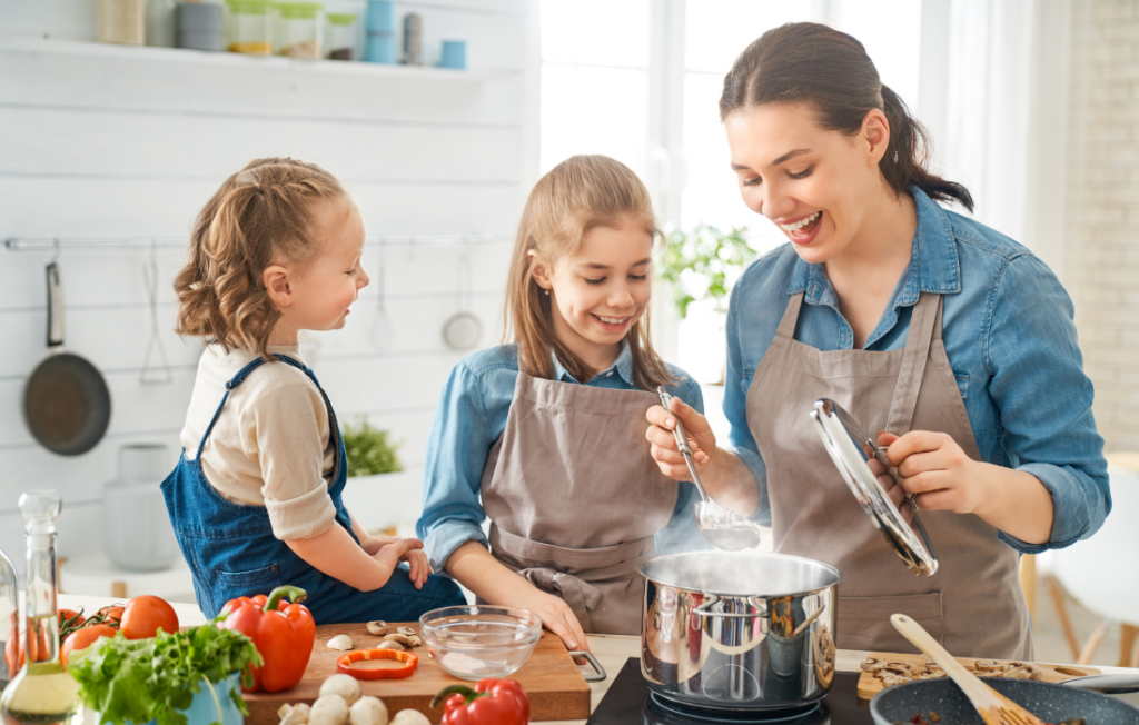 Mom and daughters cooking in the kitchen